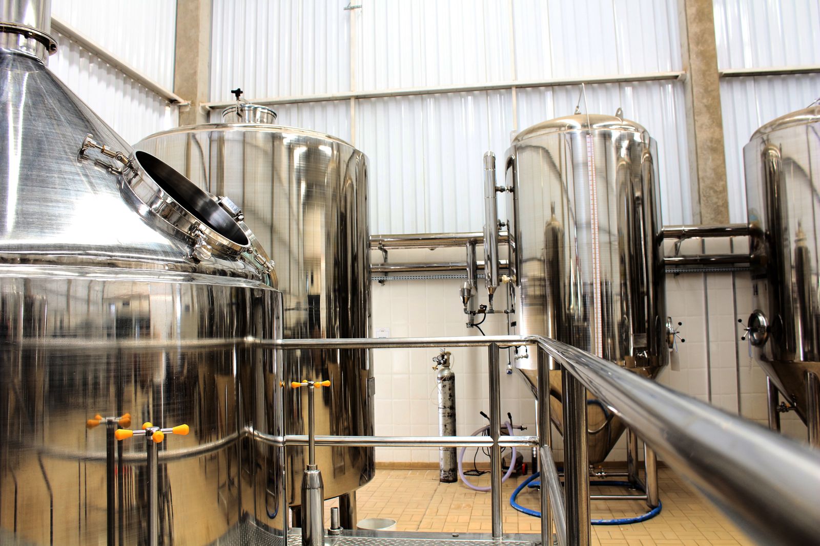Stainless steel processing tanks in a plant