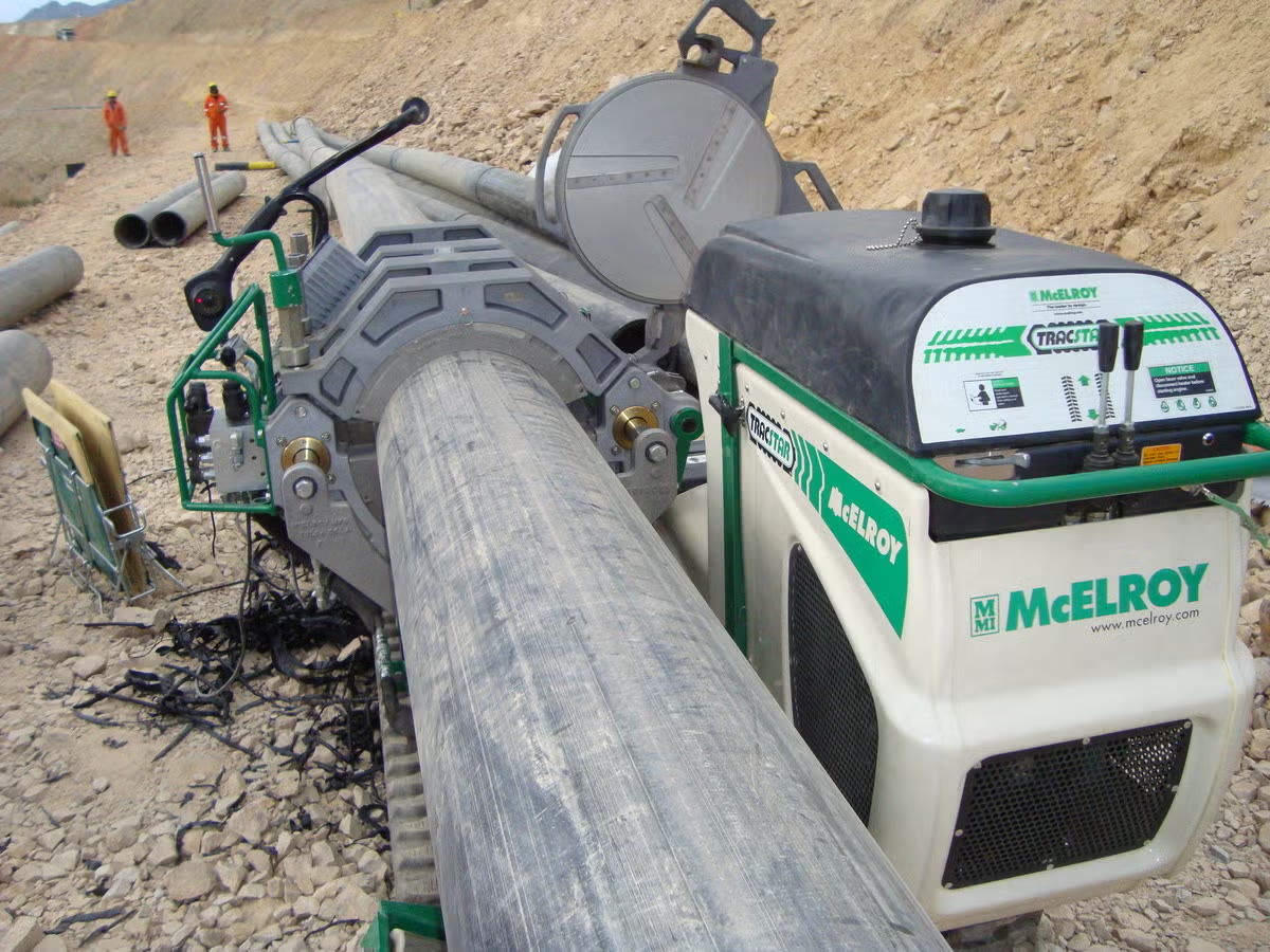 Fusion machine joining large-diameter HDPE pipe at a mine site